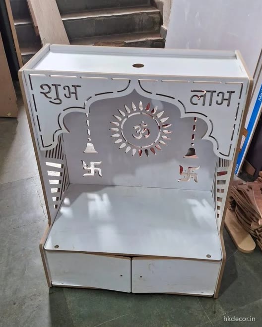Laser cut home mandir finished in white with Shubh Laabh lettering cut through the top panel