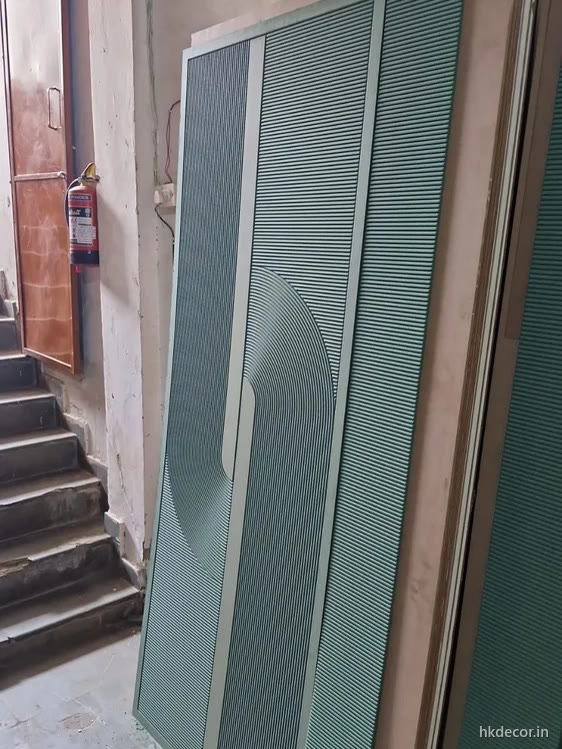 Pair of CNC cut door shutters primed together so the finish matches across both