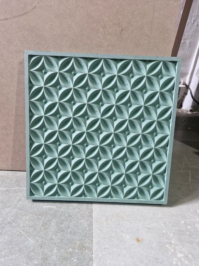 3D wall panel with a repeating carved floral lens pattern, primed MDF