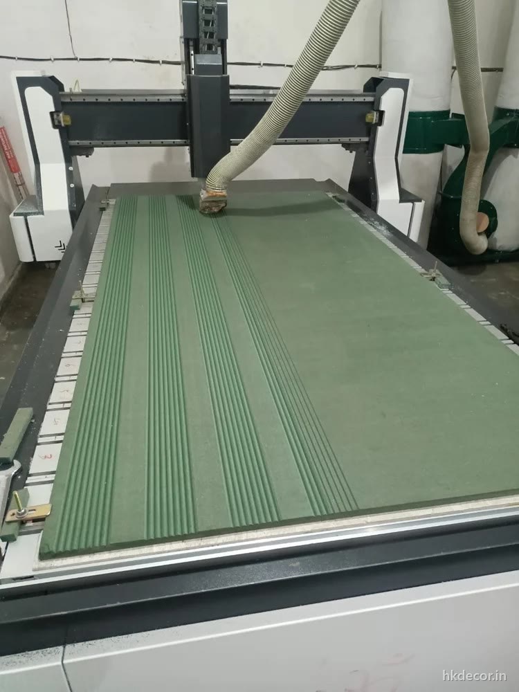 CNC router cutting flutes across a full sheet on the bed at Dream3 Bijwasan, New Delhi