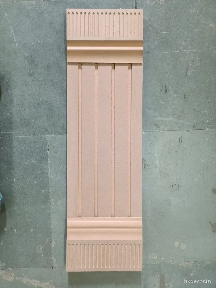 CNC cut fluted pilaster panel with stopped flutes, finished and mounted on a wall
