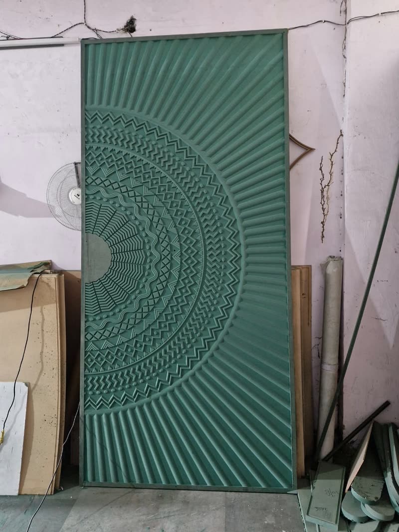 Primed half mandala CNC carved wall panel standing on the Dream3 shop floor in Bijwasan