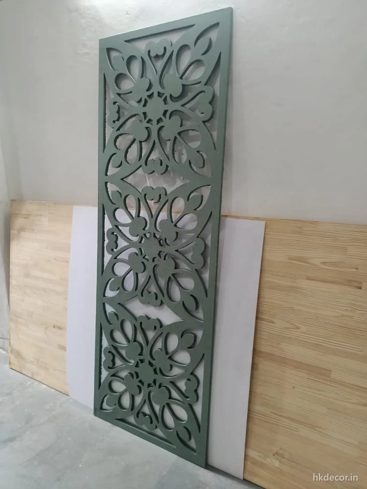 Tall CNC cut MDF jaali panel with a floral perforated pattern, primed