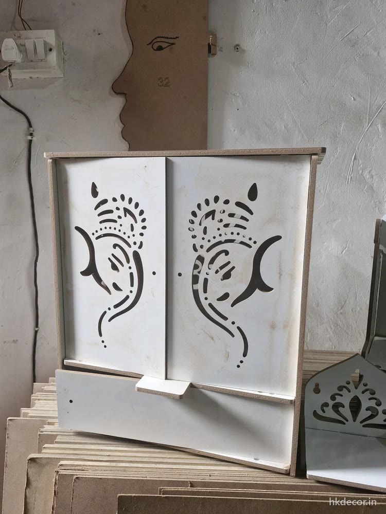 Laser cut home mandir shutters with a perforated motif, finished white
