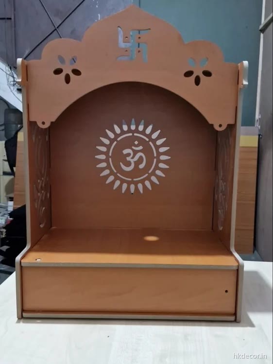 Laser cut home mandir with a radial perforated backdrop in a brown wood finish