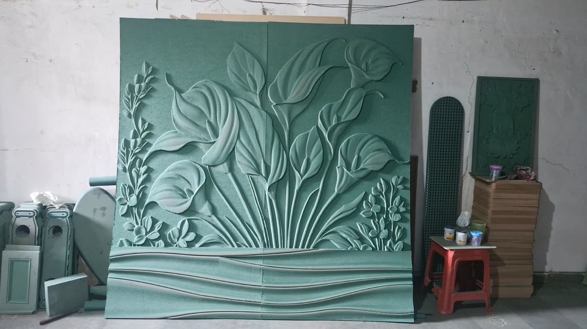 3D CNC carved lily relief wall panel above a carved wave base, primed MDF