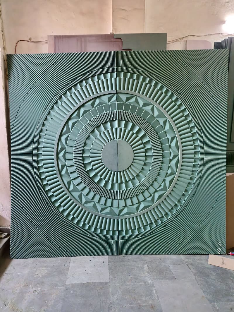 Mandala wall panel with radial CNC carving across joined boards, primed MDF