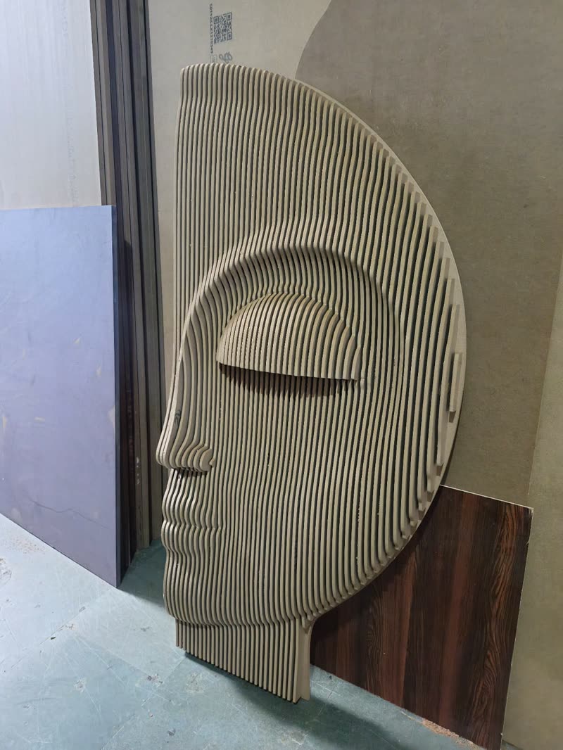 Parametric architecture panel sculpture of a face built from stacked MDF ribs, CNC cut in Bijwasan Delhi