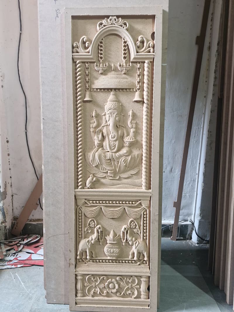 3D CNC carved pooja room door panel with a Ganesha relief in raw MDF