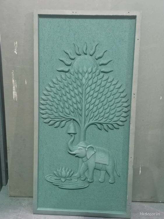 CNC carved relief panel of a tree and elephant set in a frame, primed board