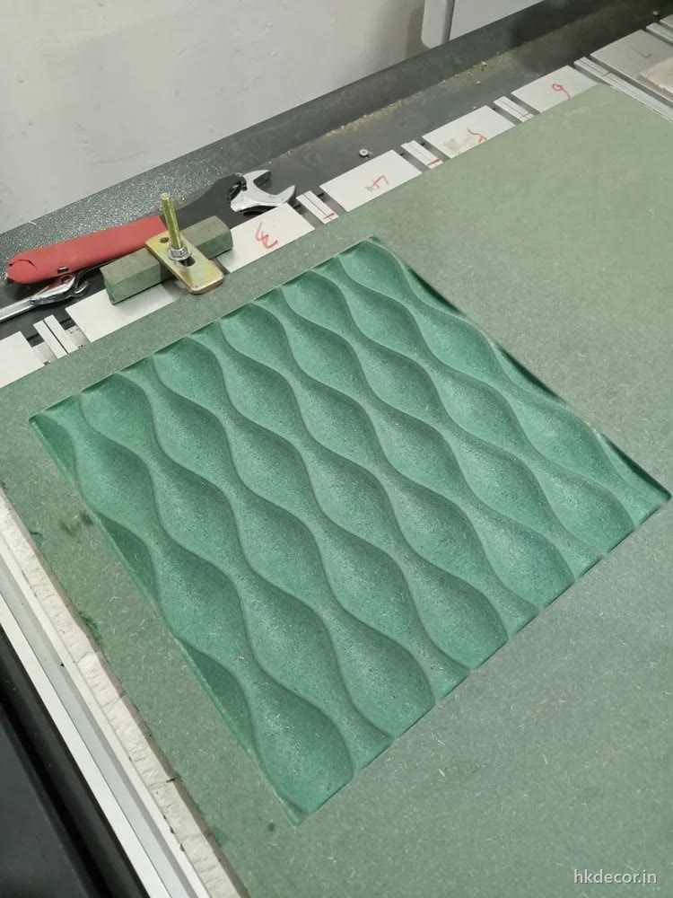CNC router cutting a 3D wave wall panel on the bed at the Dream3 unit in Bijwasan