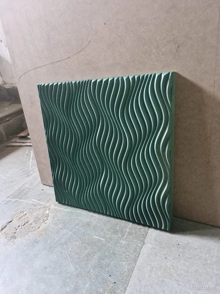 CNC cut 3D wave wall panel in primed MDF standing against a wall, Dream3 Bijwasan
