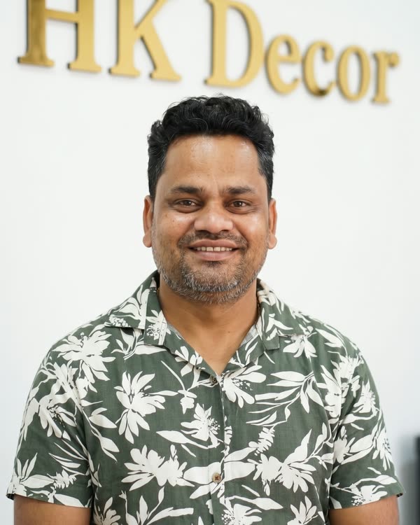 Jitender Kumar, founder of Dream3, in front of the Dream3 sign at the Bijwasan workshop